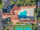 Overhead view of resort-style pool and tennis courts at 5300 S Atlantic Ave # 16-602, New Smyrna Beach, FL 32169