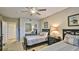 Guest bedroom with two twin beds and a mirrored closet at 5300 S Atlantic Ave # 16-602, New Smyrna Beach, FL 32169
