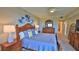 Main bedroom with king-size bed and ensuite bathroom access at 5300 S Atlantic Ave # 16-602, New Smyrna Beach, FL 32169