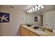 Inviting bathroom with double sinks and granite countertops at 5300 S Atlantic Ave # 16-602, New Smyrna Beach, FL 32169