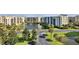 Aerial view of community with pond, landscaping, and buildings at 5300 S Atlantic Ave # 16-602, New Smyrna Beach, FL 32169