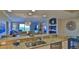 Modern kitchen with granite countertops and breakfast bar seating at 5300 S Atlantic Ave # 16-602, New Smyrna Beach, FL 32169
