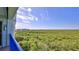 Stunning balcony view overlooking lush greenery and coastline at 5300 S Atlantic Ave # 16-602, New Smyrna Beach, FL 32169