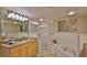 Bathroom boasts double sinks, shower, and a large mirror at 5300 S Atlantic Ave # 16-602, New Smyrna Beach, FL 32169
