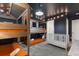 ' bedroom with bunk beds, crib, and a whimsical treehouse bed at 9106 Sommerset Hills Dr, Davenport, FL 33896