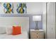 Close up of bedroom with king-size bed and abstract art at 9106 Sommerset Hills Dr, Davenport, FL 33896