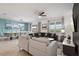Open living space featuring a sectional sofa and adjacent dining area at 9106 Sommerset Hills Dr, Davenport, FL 33896