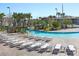 Spacious pool deck with numerous lounge chairs at 9106 Sommerset Hills Dr, Davenport, FL 33896