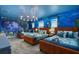 Themed bedroom with three twin beds, ocean mural, and unique lighting at 9106 Sommerset Hills Dr, Davenport, FL 33896