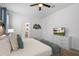 Bright bedroom with a king-size bed and TV at 9106 Sommerset Hills Dr, Davenport, FL 33896