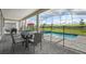 Covered patio with dining set and pool views at 9106 Sommerset Hills Dr, Davenport, FL 33896