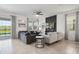 Gathering room with sectional sofa and view of the pool at 9106 Sommerset Hills Dr, Davenport, FL 33896