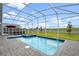 Relaxing screened pool and spa with patio furniture at 9106 Sommerset Hills Dr, Davenport, FL 33896