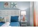 Close up of a bedroom with king-size bed and coastal decor at 9106 Sommerset Hills Dr, Davenport, FL 33896