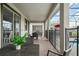 Covered patio with seating area overlooking the pool at 9106 Sommerset Hills Dr, Davenport, FL 33896