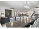 Open dining area with a large table and view of living room at 9106 Sommerset Hills Dr, Davenport, FL 33896