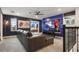 Game room featuring a galaxy mural, sectional sofa, and large TV at 9106 Sommerset Hills Dr, Davenport, FL 33896