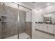 Modern bathroom with a walk-in shower and double vanity at 9106 Sommerset Hills Dr, Davenport, FL 33896