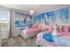 Frozen themed bedroom with two twin beds and Frozen mural at 9106 Sommerset Hills Dr, Davenport, FL 33896