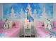 Frozen themed bedroom with twin beds, Frozen mural, and dresser at 9106 Sommerset Hills Dr, Davenport, FL 33896