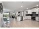 Modern kitchen with breakfast bar and open floor plan at 9106 Sommerset Hills Dr, Davenport, FL 33896
