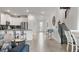 Open concept kitchen with island and stainless steel appliances at 9106 Sommerset Hills Dr, Davenport, FL 33896