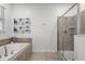 Bathroom with a large soaking tub and a walk-in shower at 9106 Sommerset Hills Dr, Davenport, FL 33896