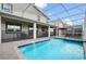 Inviting screened pool and spa with patio furniture at 9106 Sommerset Hills Dr, Davenport, FL 33896