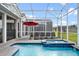Refreshing screened pool and spa perfect for lounging at 9106 Sommerset Hills Dr, Davenport, FL 33896