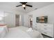 King-size bed, white dresser, and a view of the hallway at 9106 Sommerset Hills Dr, Davenport, FL 33896