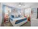 Bedroom with king-size bed, coastal decor, and ample natural light at 9106 Sommerset Hills Dr, Davenport, FL 33896