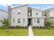Modern two-story home with stone accents and landscaping at 9106 Sommerset Hills Dr, Davenport, FL 33896