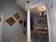 Bright entryway with decorative column and view into dining area at 1046 Shinnecock Hills Dr, Oviedo, FL 32765
