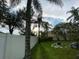 Private backyard with lush greenery and a white fence at 1046 Shinnecock Hills Dr, Oviedo, FL 32765