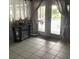 View of backyard pool from dining room with glass doors at 1046 Shinnecock Hills Dr, Oviedo, FL 32765