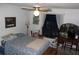 Bright bedroom with queen-size bed and window at 2681 Washington Ave # 18, Eustis, FL 32726