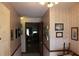 Home entryway with view into living room at 2681 Washington Ave # 18, Eustis, FL 32726