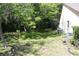 Partially fenced backyard with mature trees at 2681 Washington Ave # 18, Eustis, FL 32726