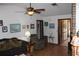 Spacious living room with hardwood floors and fireplace at 2681 Washington Ave # 18, Eustis, FL 32726