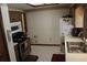 Kitchen with stainless steel appliances, wood cabinets, and a view into the dining room at 2681 Washington Ave # 18, Eustis, FL 32726