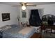 Bright bedroom with queen-size bed and window at 2681 Washington Ave # 18, Eustis, FL 32726
