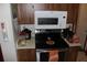 Close-up of kitchen's stainless steel stove and microwave at 2681 Washington Ave # 18, Eustis, FL 32726