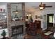 Cozy living room with a fireplace and comfortable seating at 2681 Washington Ave # 18, Eustis, FL 32726