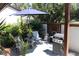 Outdoor patio with seating area, grill, and umbrella at 2681 Washington Ave # 18, Eustis, FL 32726