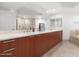 Double vanity bathroom with a large mirror and a soaking tub at 231 Riverside Drive # 101-1, Holly Hill, FL 32117
