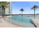 Relaxing pool area with water and lounge chairs at 231 Riverside Drive # 101-1, Holly Hill, FL 32117