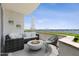 Relaxing balcony with fire pit and outdoor seating at 231 Riverside Drive # 101-1, Holly Hill, FL 32117