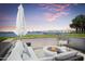 Relaxing patio with fire pit and stunning water views at 231 Riverside Drive # 101-1, Holly Hill, FL 32117