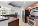 Updated kitchen featuring stainless steel appliances and wood cabinets at 231 Riverside Drive # 101-1, Holly Hill, FL 32117