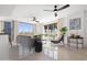 Bright living room with water views and tiled floors at 231 Riverside Drive # 101-1, Holly Hill, FL 32117